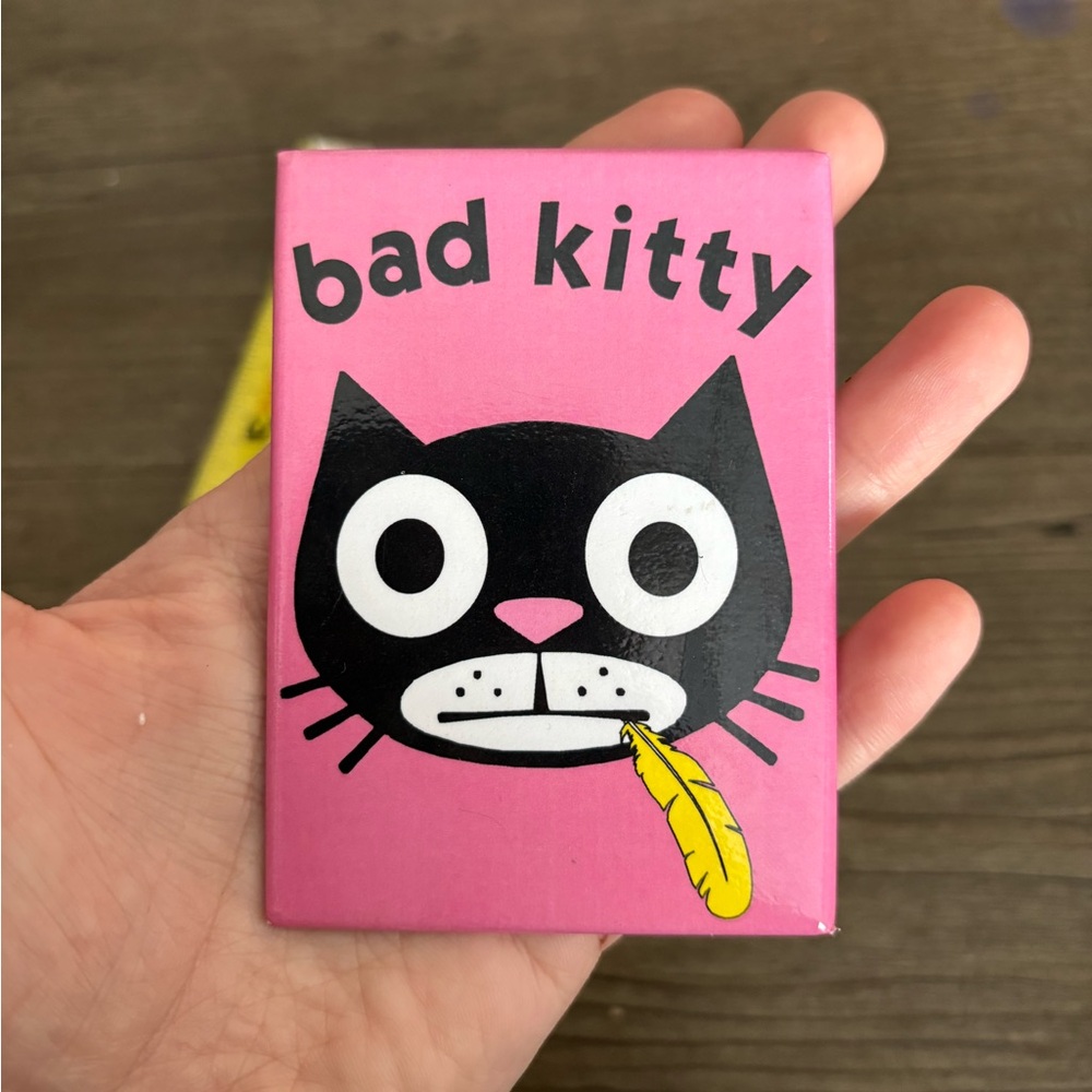 BAD KITTY W/ FEATHER IN MOUTH MAGNET